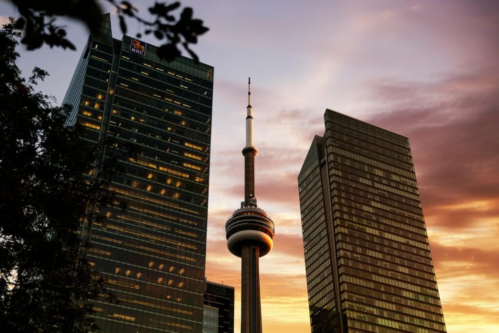 pexels-photo-3127932-3127932 Capture the iconic CN Tower and surrounding skyscrapers in Toronto at sunset with this breathtaking cityscape.
