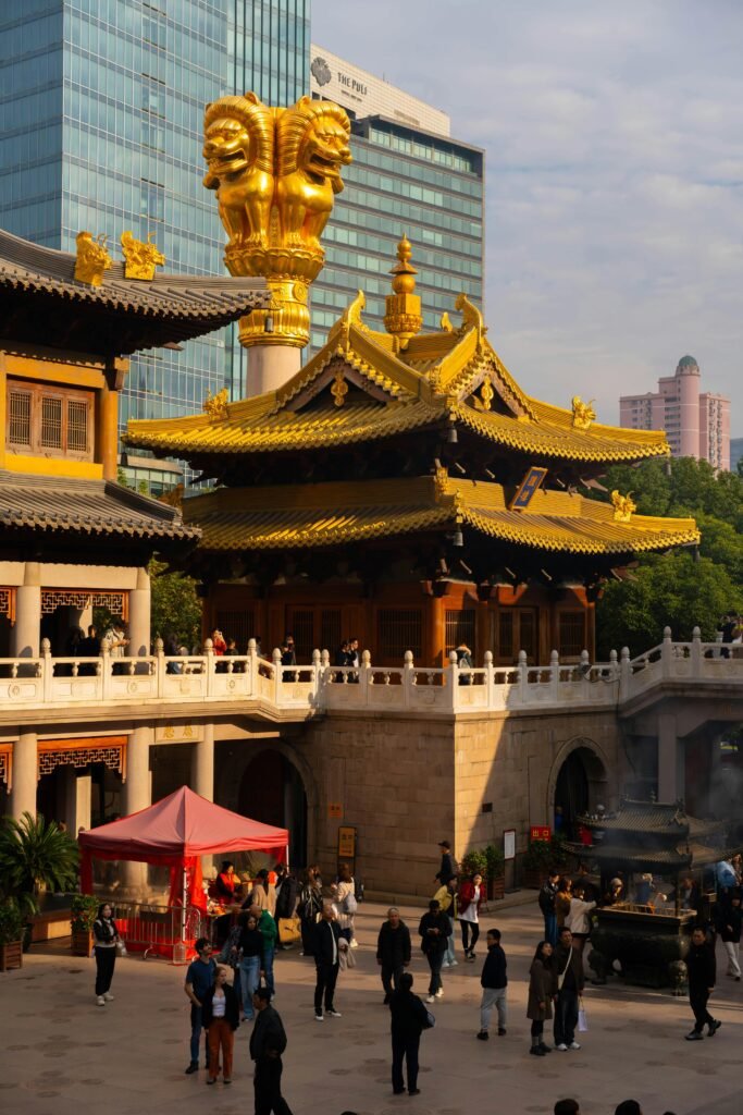 pexels-photo-34922334-34922334 Vibrant scene at Jing'an Temple in Shanghai with golden architecture and lively visitors.